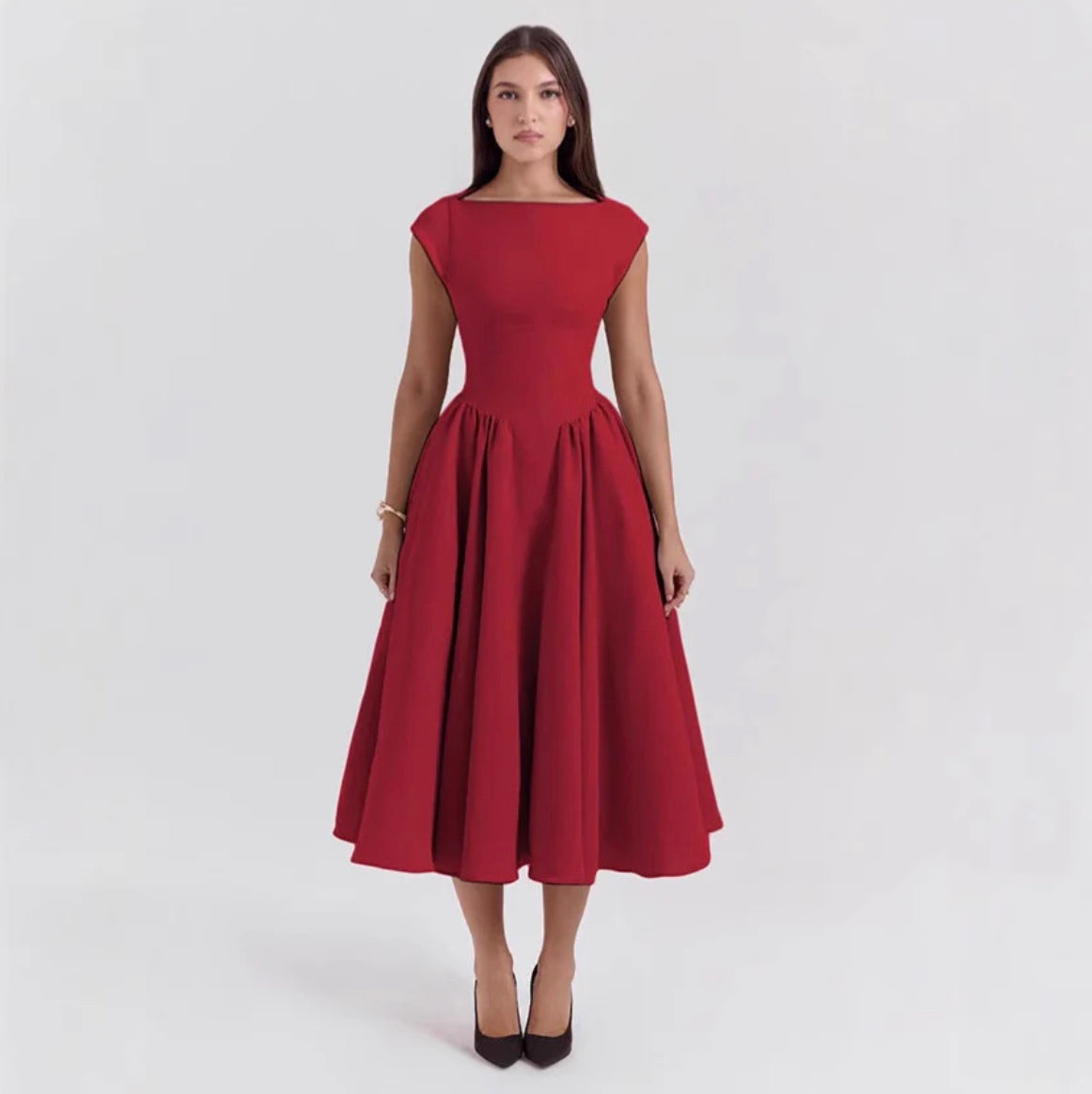 Red dress worn by a model on a white background