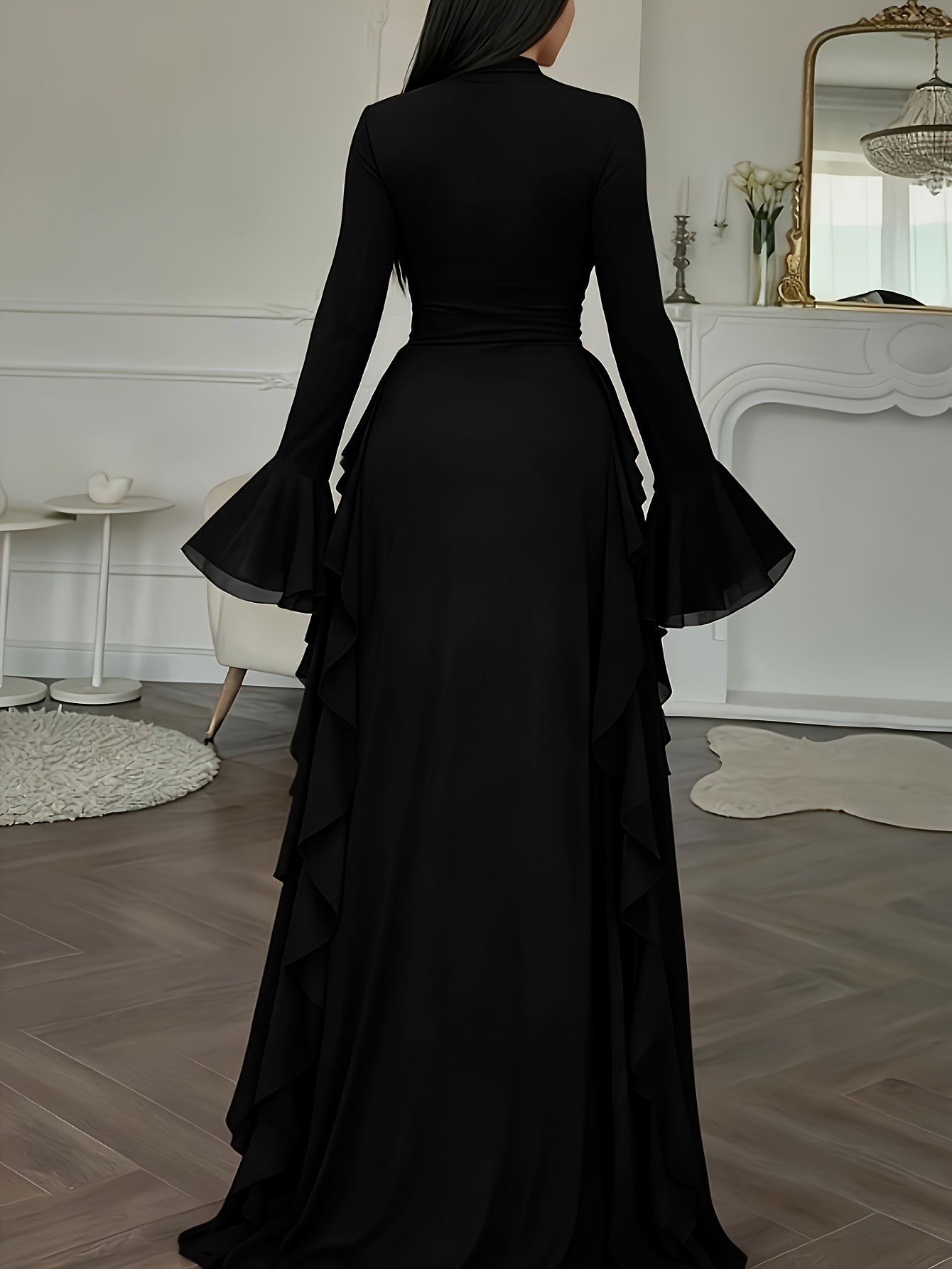 Black evening gown with ruffled details in a room setting
