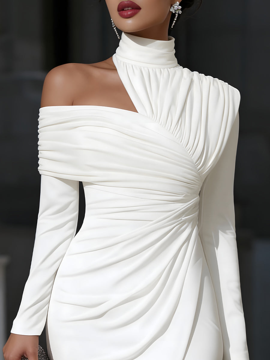 White off-shoulder dress worn by a model against a dark background