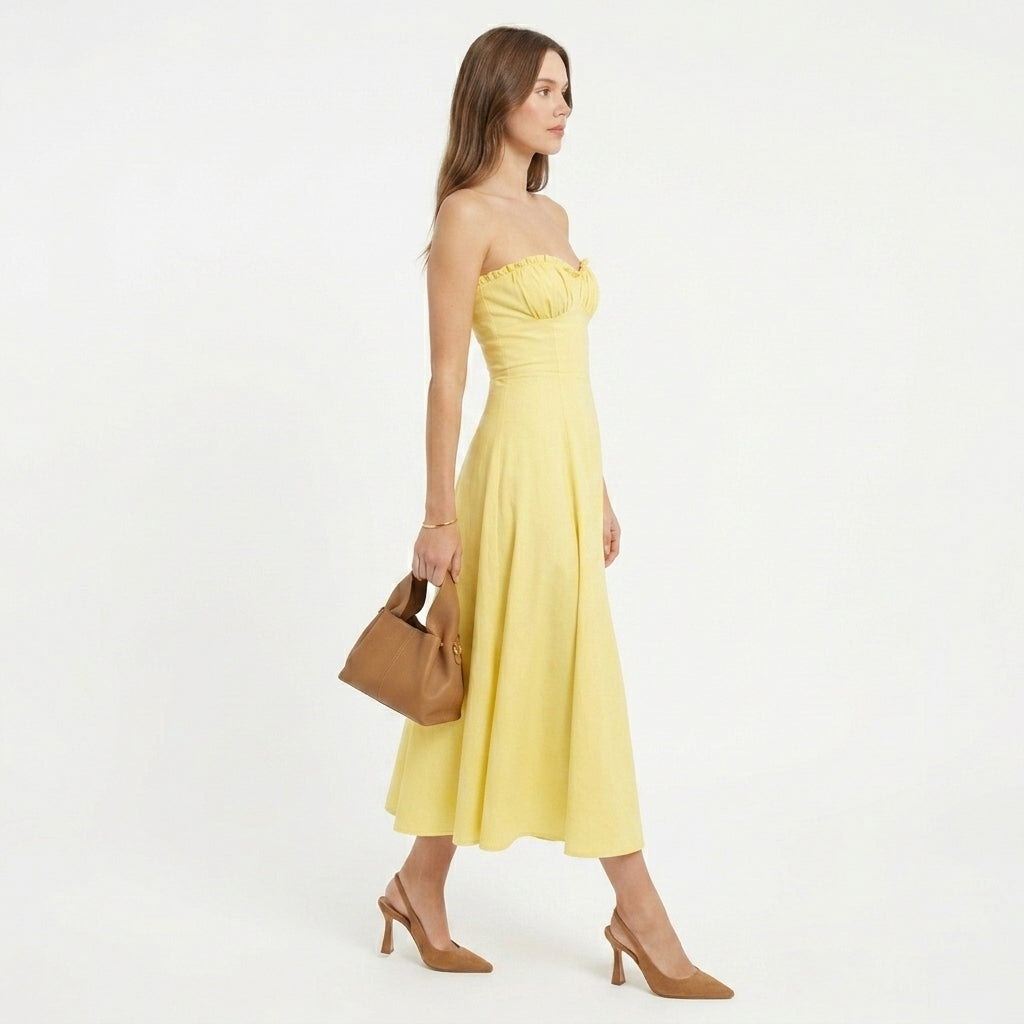 Millicent yellow bustier wedding guest midi dress - back view