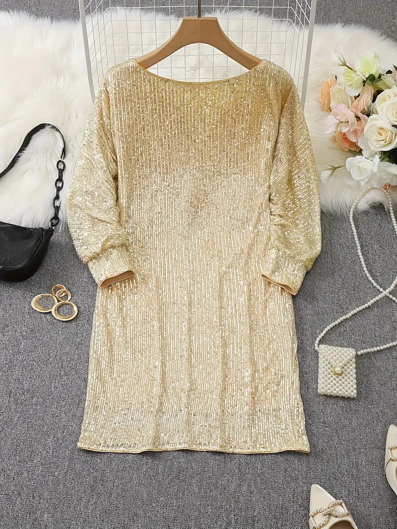 Gold glitter dress on a hanger with a black handbag and flowers in the background