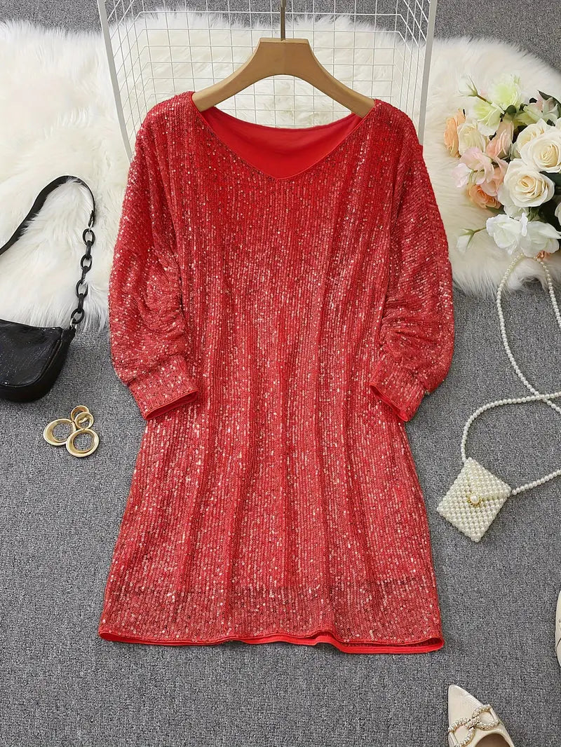 Red glittery dress on a hanger with a white fur rug and decorative items in the background
